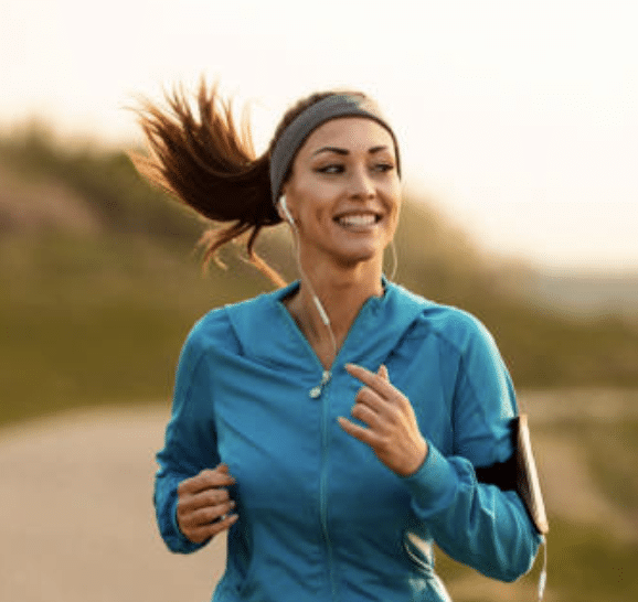 A Woman Jogging Focused On Fitness — Bespoke in Southport, QLD