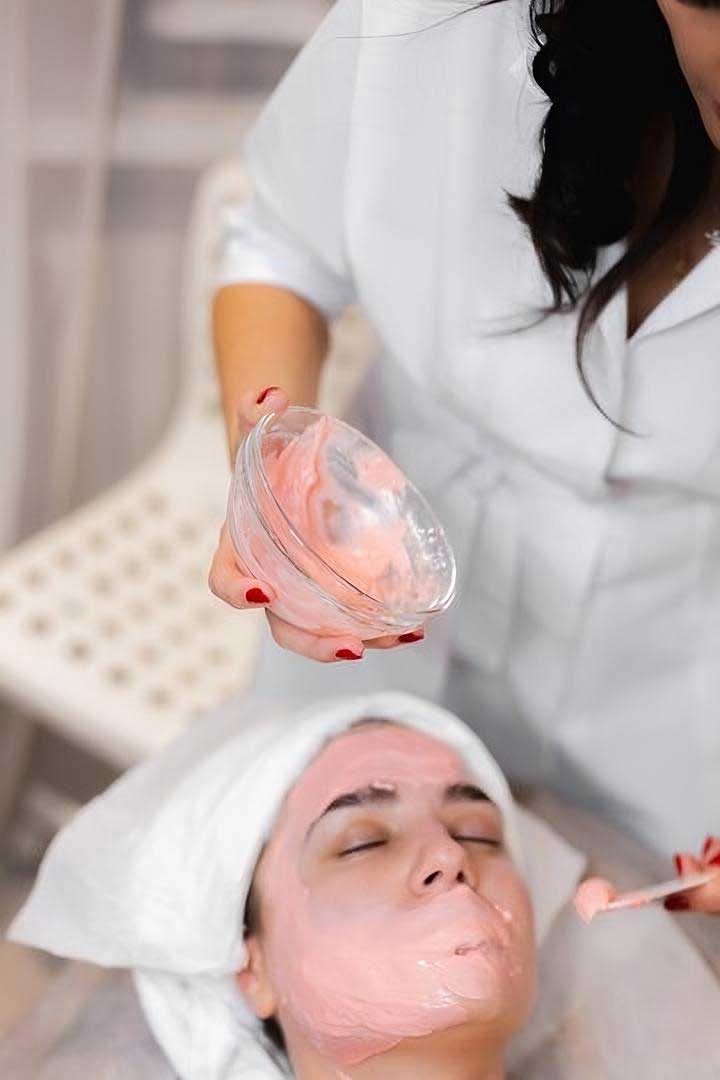 Woman Relaxing During Facial At Serene Spa With Calming Decor — Bespoke in Southport, QLD