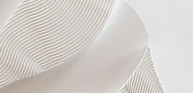 A White Paper Sculpture with Elegant, Wavy Lines for A Dynamic Visual Effect — Bespoke in Southport, QLD